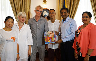 President Faure presented with first copy of “Art in Seychelles Then and Now”